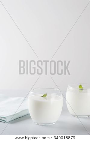 Organic Probiotic Milk Kefir Drink Or Yogurt In Two Glasses . Fermented Dairy Drink. Image With Copy