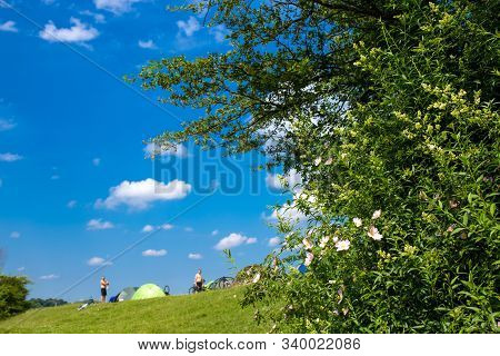 Camp With Bycicle Travelers On Beautiful Location At Nice Sunny Day