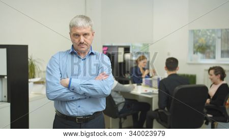 Working Day In The Office, Unkind Man Stand And Look At Camera