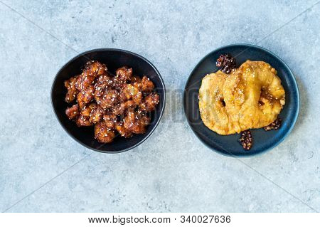 Asian Food Homemade Chinese General Tsos Chicken And Fried Pineapple Fritters Caramelized With Cinna