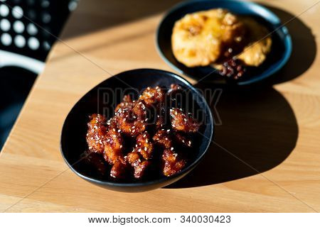 Asian Food Homemade Chinese General Tsos Chicken With Sesame Seeds Served With Chopsticks.