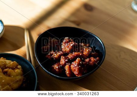 Asian Food Homemade Chinese General Tsos Chicken With Sesame Seeds Served With Chopsticks.