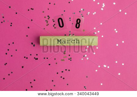 Background For Woman Day, 8 March. View From Above With Copy Space. Pink Background With Multicolore