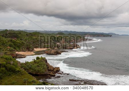 Green Rocky Coast Of Java Island Indonesia. Javanese Landcape.
