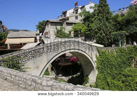View Of The Crooked Bridge (kriva Cuprija) In Historic Mostar, Bosnia And Herzegovina