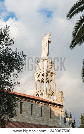 Jerusalem, Israel, December 07, 2019 : Statue Of The Mother Of God With A Baby In Her Arms On The Ro