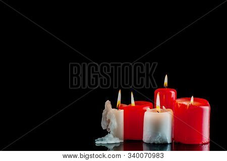 Burning Candles On A Black Background. Symbol Of Religion Or Grief And Loss Or Tragedy. Template For