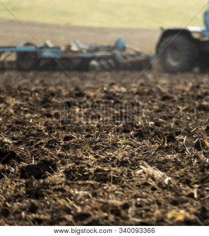 Plowed Plowland Of Black Earth In An Autumn Field.