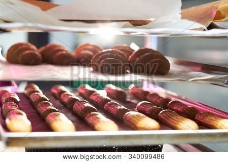 Fresh Cookies With Chocolate Are Ready To Be Removed From The Oven At Bakery Shop.