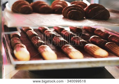 Fresh Cookies With Chocolate Are Ready To Be Removed From The Oven At Bakery Shop.