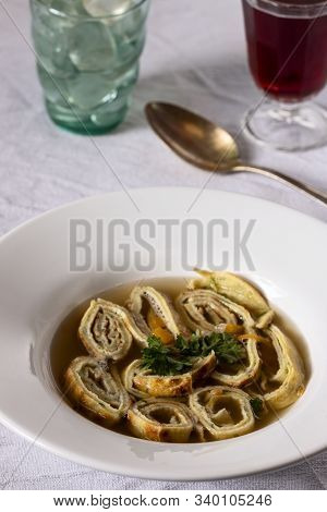 Bavarian Pancake Soup In A Bowl On White