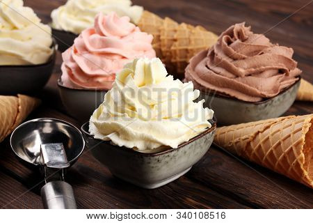 Soft Ice Cream In Flavor Vanilla, Chocolate And Strawberry. Delicous Creamy Refreshing Ice Cream