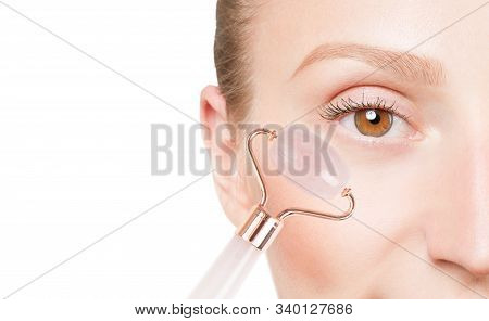 Beautiful Female Eye. Anti-aging Treatment Wrinkles Under Eye With Jade Roller. Face Massage With Ja