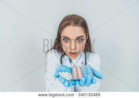 Closeup Portrait Of Young Female Intern Showing Her Palms Full Of Different Pills, Looking Crazily, 