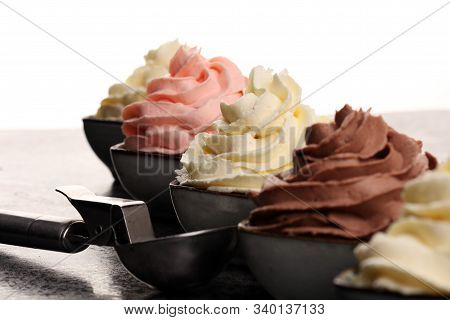 Soft Ice Cream In Flavor Vanilla, Chocolate And Strawberry. Delicous Creamy Refreshing Ice Cream