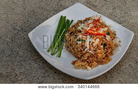Asian Eating Food, Mee Grob Is An Sweet And Sour Crispy Noodles, Made From Thai Rice Noodle With Swe