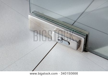 The Lock On The Glass Door, The Mechanism Of Locking The Doors With The Keyhole On The Glass Door, C