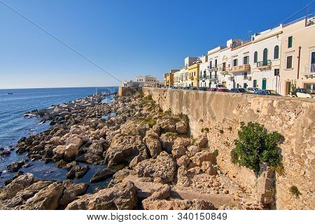 Coastline Cityscape With Colorful Houses During A Bright Atumn Day At Gallipoli Puglia Italy