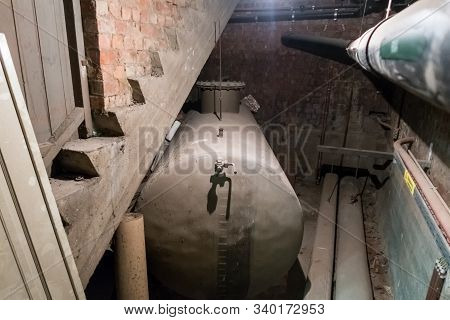 In A Separate Room In A Old Building, There Is A Heating Oil Tank