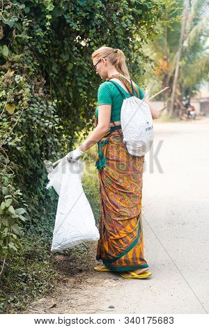 Mayapur, West Bengal, India - Dec 14, 2019. Female Volunteer Collects Garbage In India With Recycle 
