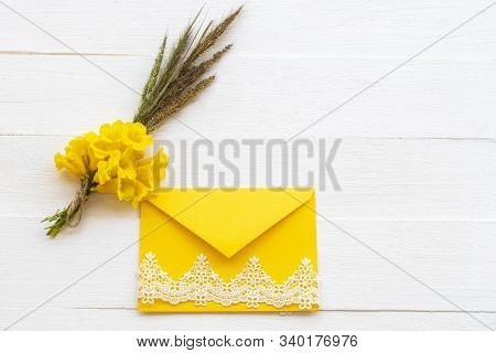 Background Texture Nature Bouquet Yellow Flowers In Yellow Envelope Decoraton Flat Lay Postcard Styl