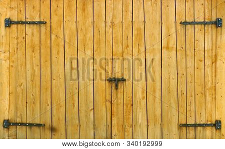 Yellow wooden gate on the ranch house for background or texture