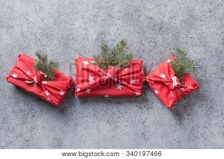 Christmas Gifts Wrapped In Red Textile With Natural Decor. Sustainable Gifts. Zero Waste. Xmas Eco H