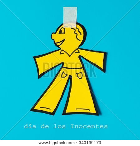 a paper man on a blue background, as a prank for the dia de los inocentes, the innocents day, a feast held in spain, hispanic america and philippines equivalent to april fools day