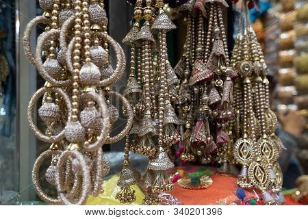 Colorful Metallic Decorations On Display For Sale In Chandi Chowk Old Delhi. These Flowers, Beads An
