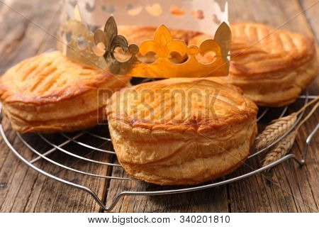 epiphany cake and crown on wood background
