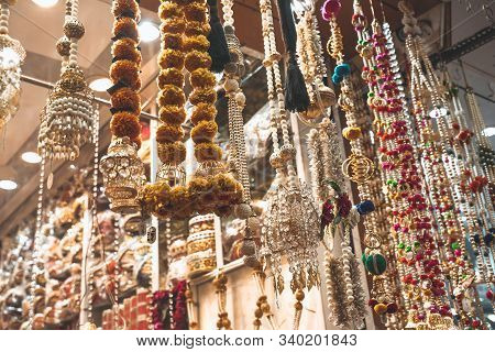 Colorful Metallic Decorations On Display For Sale In Chandi Chowk Old Delhi. These Flowers, Beads An