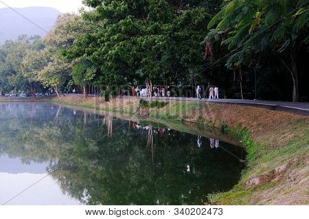 Buddhist Monk And People Walking For Mindfulness Meditation