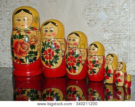 Matryoshka-russian Folding Doll Made Of Wood, Inside Which There Are Dolls Of Smaller Size. Semenovs