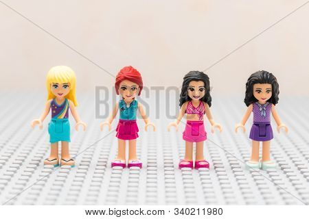 Kouvola, Finland - 18 December 2019: Lego Friends Minifigures On Gray Baseplate