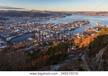 Bergen City And Northern Fjord View From Mount Floyen In Autumn Frosty Morning. Earky Sunlight On Bu