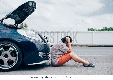 Woman Unhappy And Dismal From Car Engine Problem