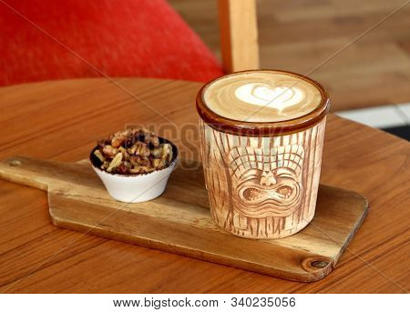 Latte Art, Coffee With Nuts On A Wooden Board