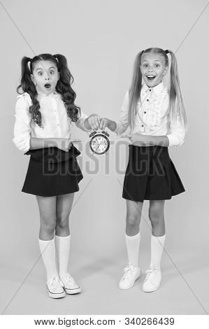 It Is Time. School Schedule. Schoolgirls And Alarm Clock. Children School Pupils. Knowledge Day. Sch