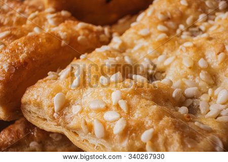 Freshly Prepared Puff Pastry With Sesame Seeds Close-up. Macro Photograph Of A Cookie Texture. Home 
