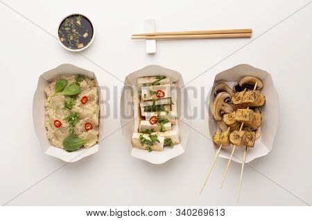 Alternative Asian Lunch. Paper Plates With Quinoa Porridge, Tofu And Grilled Tempeh Served With Soy 