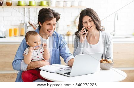 Family Business. Partners Spouses Working From Home, Consulting Clients Online At Kitchen