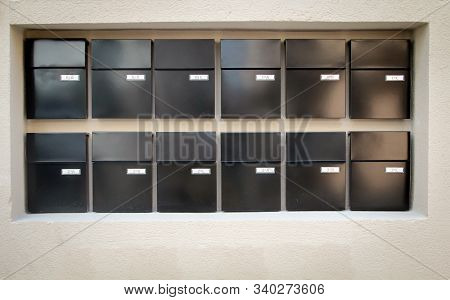 Mailboxes Lined Up In Rows On A Wall