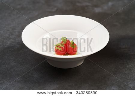 Fresh Peeled Chili Tomatoes And Minced Cucumbers On Dark Background