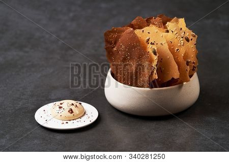 Cereal Chips With Seeds And Kimchi Mayonnaise Sauce On Dark Background