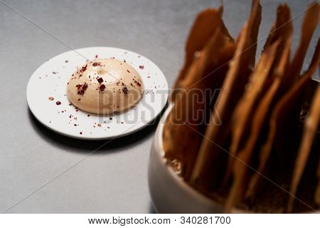 Cereal Chips With Seeds And Kimchi Mayonnaise Sauce On Dark Background