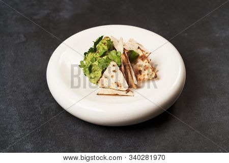 Guacamole With Pita Chips On White Plate. Chef's Signature Dish
