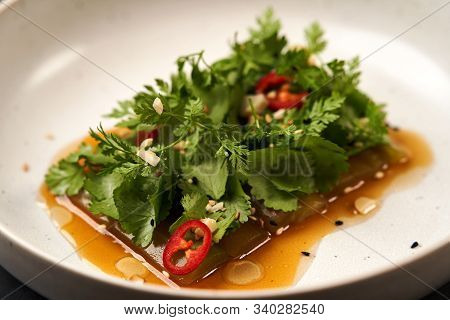 Smashed Cucumbers Plate With Red Chili Pepper Garlic Parsley And Vegetable Oil