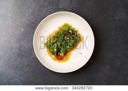 Smashed Cucumbers Plate With Red Chili Pepper Garlic Parsley And Vegetable Oil