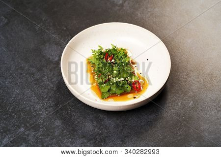 Smashed Cucumbers Plate With Red Chili Pepper Garlic Parsley And Vegetable Oil