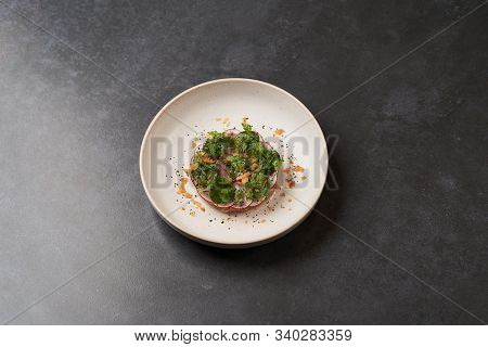 Fresh Beef Tartare Dish With Fresh Vegetables In White Plate